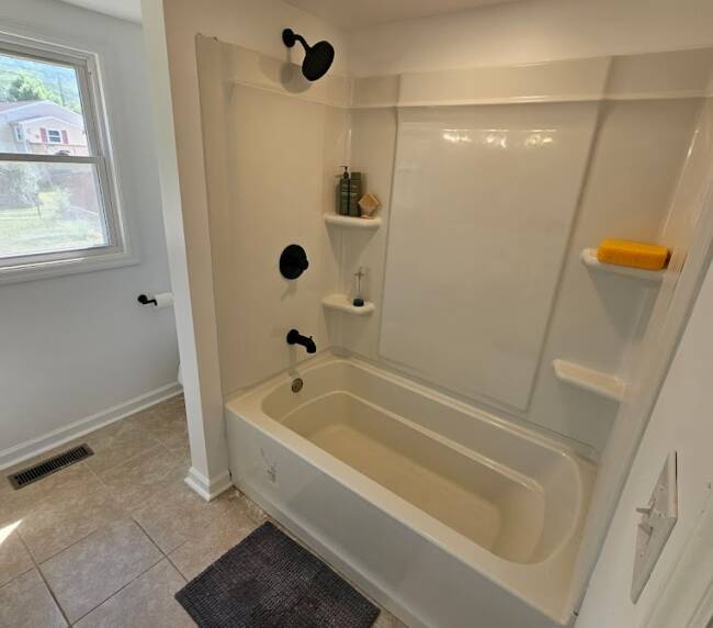 Bathroom and bathtub/shower after being renovated by Lexington Contracting