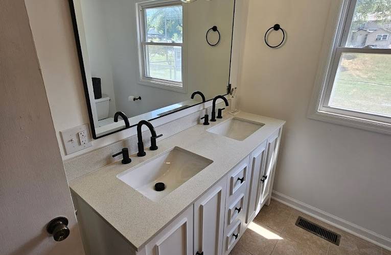 Example of home additions featuring updated bathroom after being renovated by Top Quality Builders